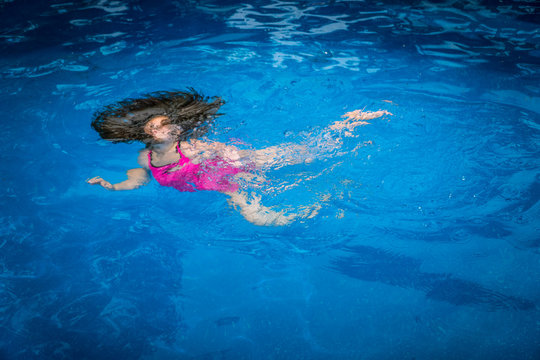 Pool Safety - Young Girl Drowning, Struggling to Swim Underwater in Pool