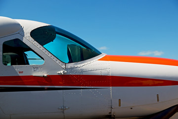 parking in the airport window of little popular   plane