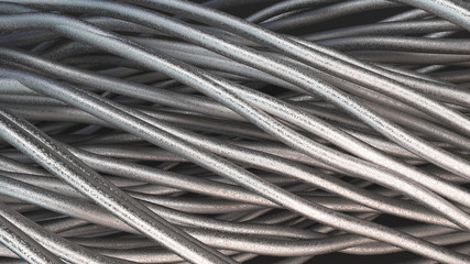 Twisted aluminum wires on black surface - 184511515