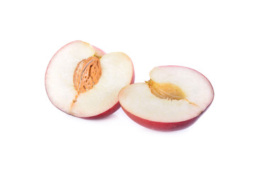 half cut fresh ripe nectarines on white background