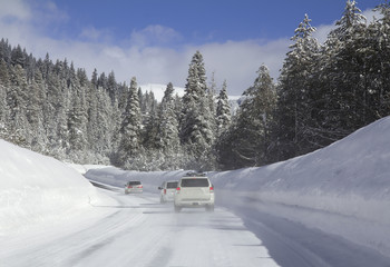 Fototapeta na wymiar Driving in snow. Cars on the snowy road.