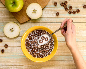 Chocolate cereal flakes rings with milk top view