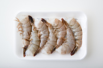 isolated black tiger shrimp in plastic tray