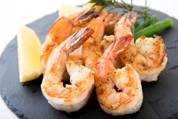 grilled shrimp on black plate