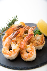 grilled shrimp on black plate