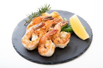 grilled shrimp on black plate