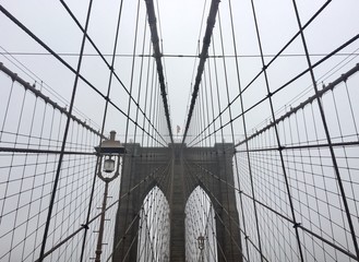 Brooklyn bridge and cables in the mist