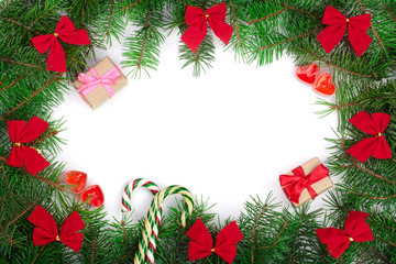 Fototapeta na wymiar Christmas frame decorated with red bows isolated on white background with copy space for your text. Top view