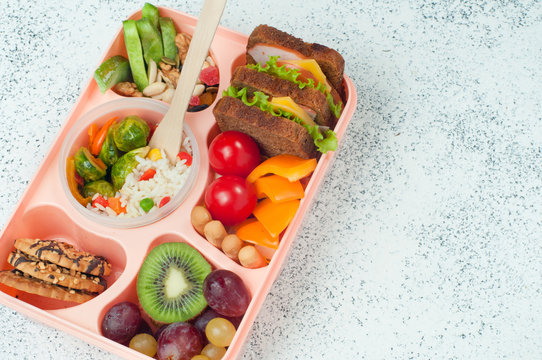 Close up of open lunch box on the grey background with copy space