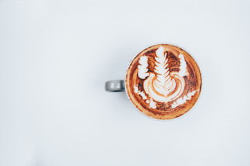 Cup of latte art on white background.