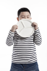 boy(kid) hand hold a empty dish isolated on the white background.