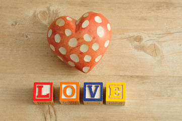Valentine's Day. Love spelled with colorful alphabet blocks and a red heart