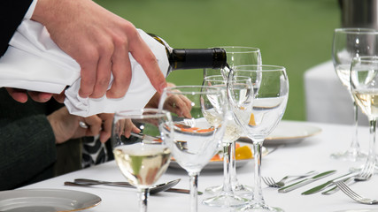 White wine pouring into glass