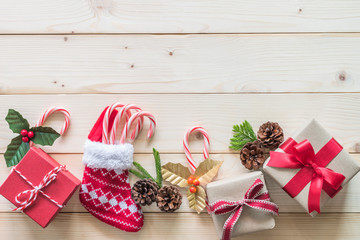 Christmas gift background with red box of present on white pine wood background for X'mas winter holiday backdrop and design decoration