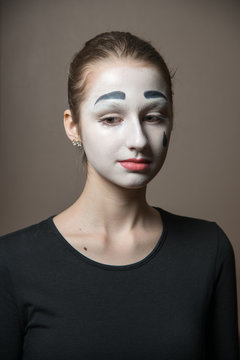 Sad mime. The girl with makeup of the mime.