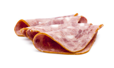 Sliced ham on white background.Fresh prosciutto.Pork ham sliced on white background
