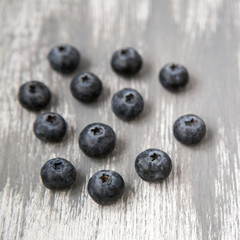 Fresh and Organic Blueberries Scattered on Wooden Background Natural Light Selective Focus