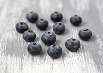 Fresh and Organic Blueberries Scattered on Wooden Background Natural Light Selective Focus