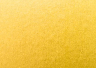 Gold foil leaf metallic wrapping paper shiny texture background for Christmas and holiday wall paper decoration element