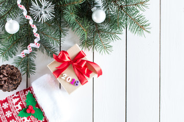 Christmas gifts and numbers 2018, Christmas stockings in christmas pattern Christmas tree on white  wooden background, top view