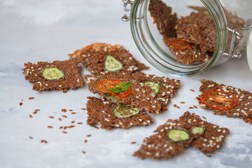 Crispy vegetable flax bread with sesame seeds and herbs.