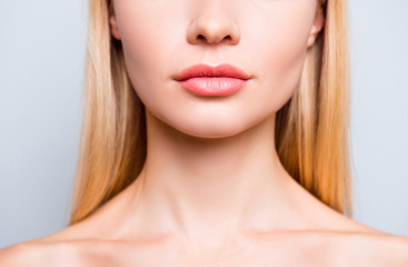 Close up cropped photo of attractive woman's lips without lipstick and after having shape correction, she has expression wrinkles. She is isolated on grey background - obrazy, fototapety, plakaty