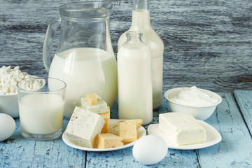 Set of different milk products on the wooden background