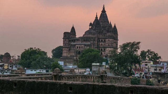 Time lapse at Orchha Palace, hindu temple, cityscape at sunset, Madhya Pradesh. Also spelled Orcha, famous travel destination in India.