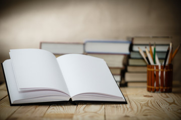Textbooks and books on a wooden table