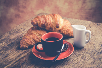 croissants and coffee for breakfast - rustic vintage style photo