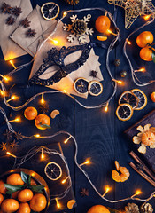 Christmas lights, mask and oranges