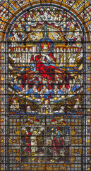 LONDON, GREAT BRITAIN - SEPTEMBER 14, 2017: The Jesus Christ the King on the stained glass in the church St. Edmund the King from 19. cent.