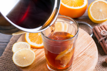 Preparation of mulled wine with orange and spices