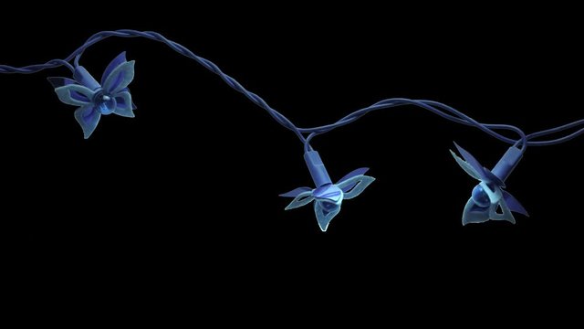 blinking new year christmas blue batterfly garland isolated on black background. fragment of 3 lights.