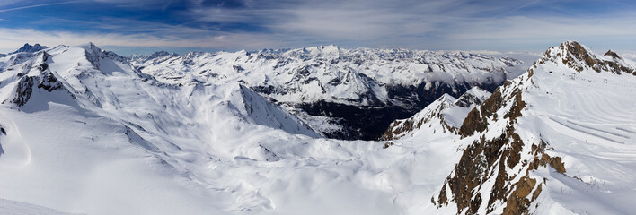 Panoramic view of Alps Mountains from Top of Salzburg Kitzsteinhorn National Park Gallery high-altitude platform with blue sky and white clouds in background at Zell Am See Kaprun Austrian ski resort