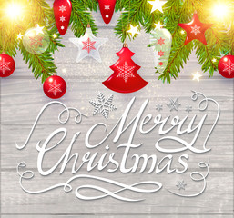 Merry Christmas Calligraphic Lettering on Elegant Soft Wood Textured Background with Golden Lights, Fir Tree Branches and Christmas Toys. Vector illustraion