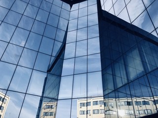 Office Glass building with clouds reflection