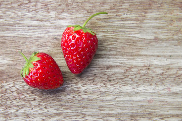 Fresh strawberries on wooden table,Red strewberry prepatation to make Strawberry Juice.Healthy and delicious organic fruit