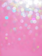 Pink and colorful bokeh light abstract background texture. Christmas and Valentine's pattern bokah, wallpaper.