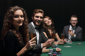 beautiful woman sitting at a table in a casino