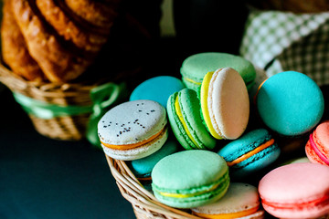 Sweet colourful french macaroons and  Croissants