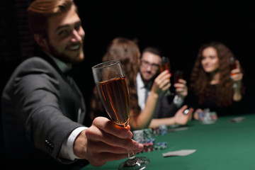 poker player with a glass of wine