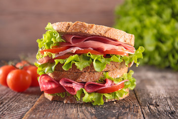 big sandwich on wood background