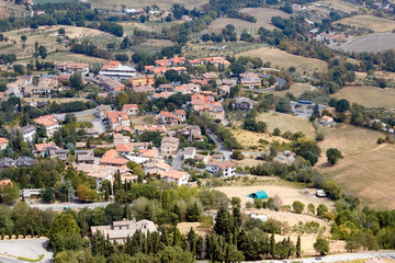 Obraz premium San marino, San Marino - July 10, 2017: View from the top of the view on houses with red roofs.