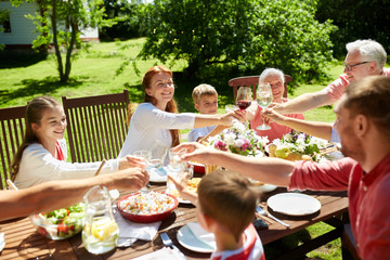 happy family having dinner or summer garden party