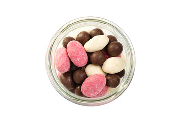 Set of colorful nuts dragees on white background. Top view