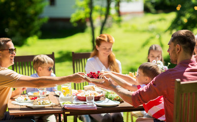 happy family having dinner or summer garden party