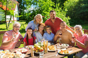 happy family having dinner or summer garden party