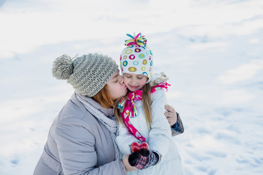 Mother and daughter in winter park