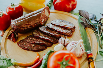 Antipasti and catering platter with different meat and cheese products. Various mixed meat and vegetable appetizers . Europe dinner food (German name is Brettljause).
